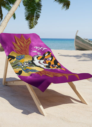 Soft purple beach towel on sand